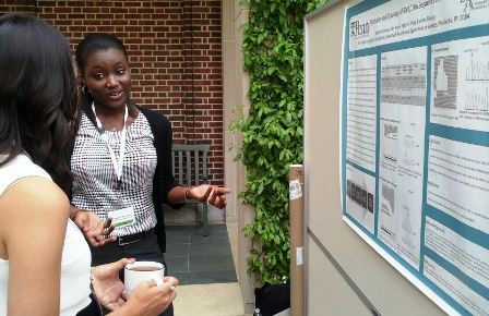 student presenting poster