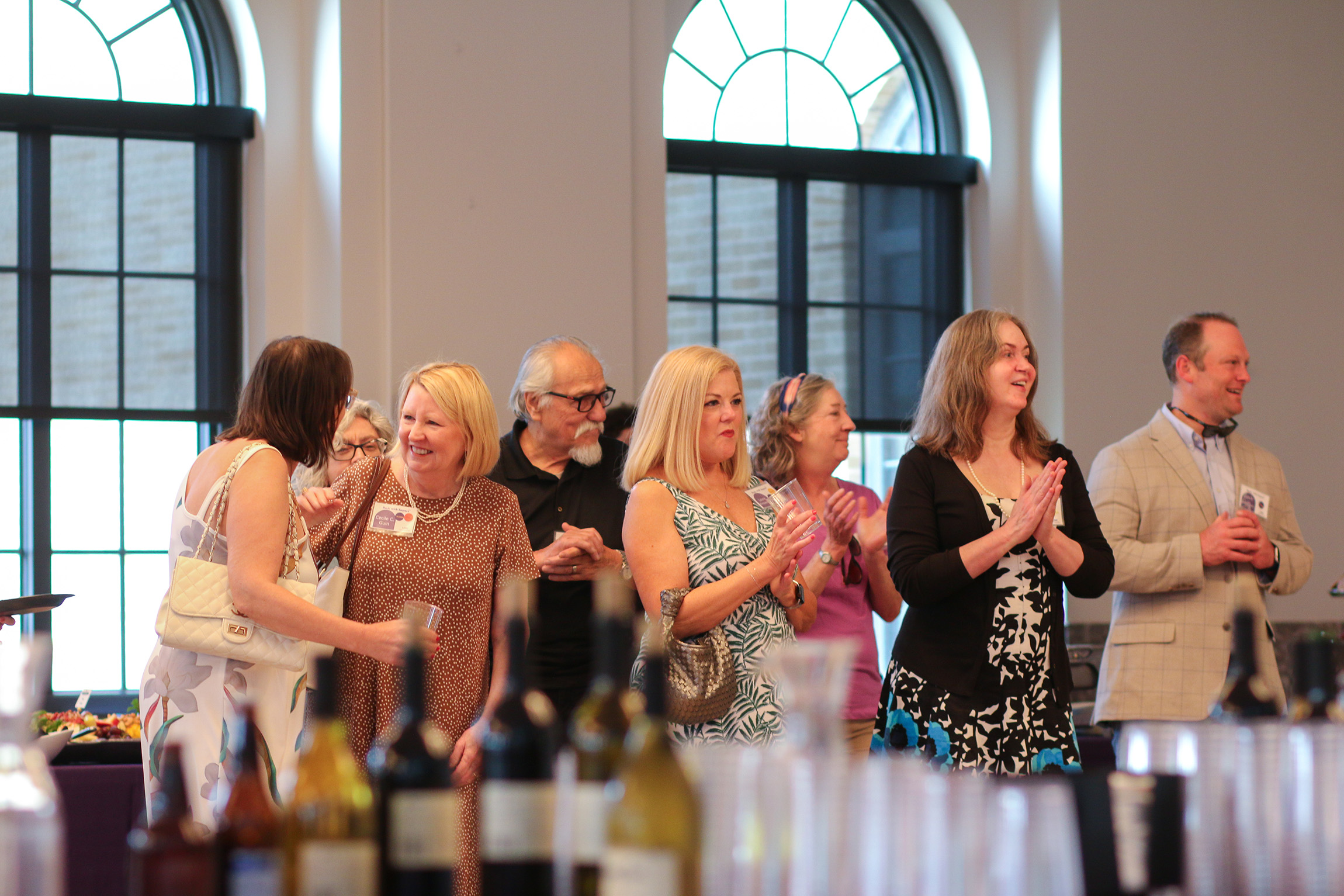 people standing and smiling at an event