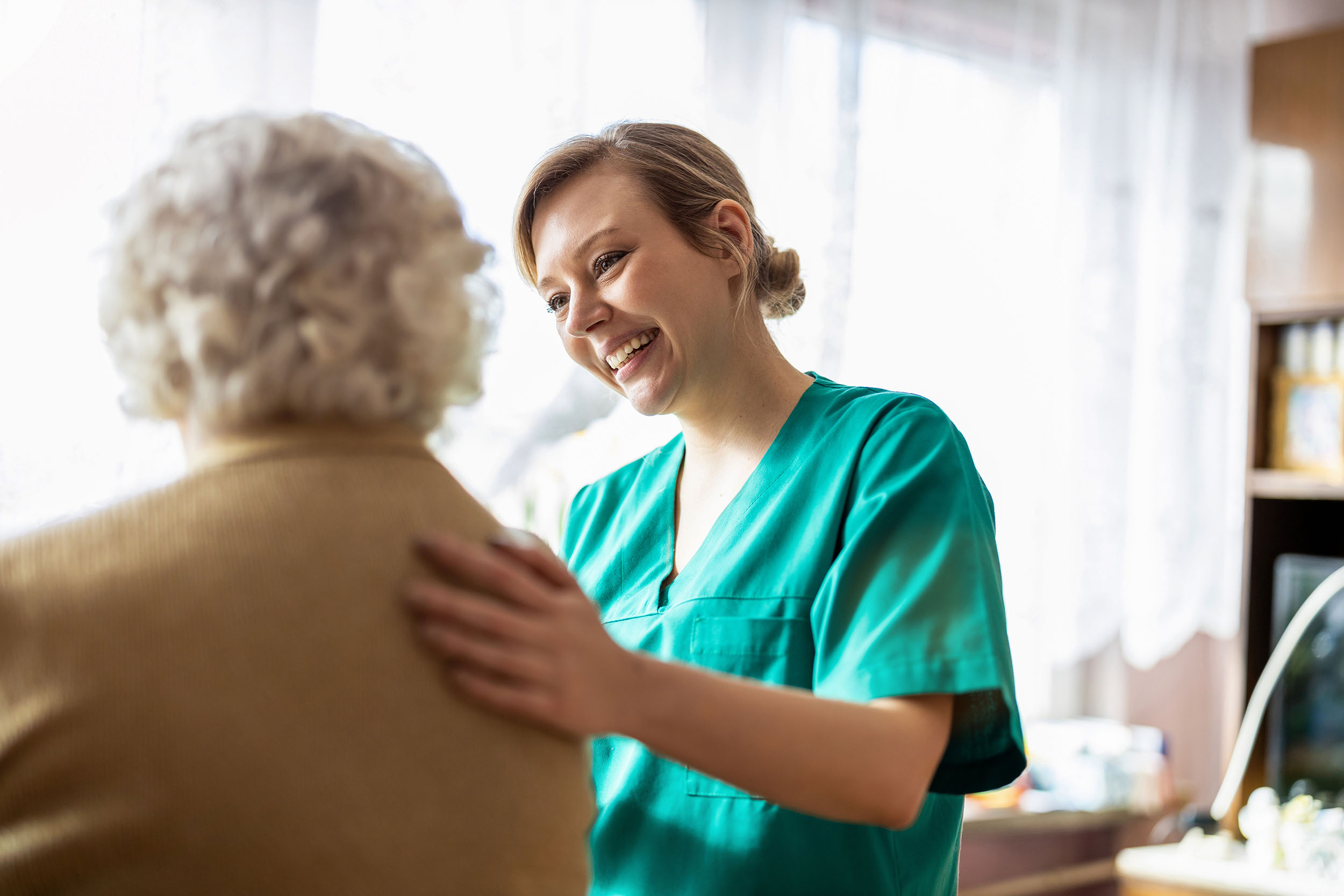 photo of nurse with an older female patient