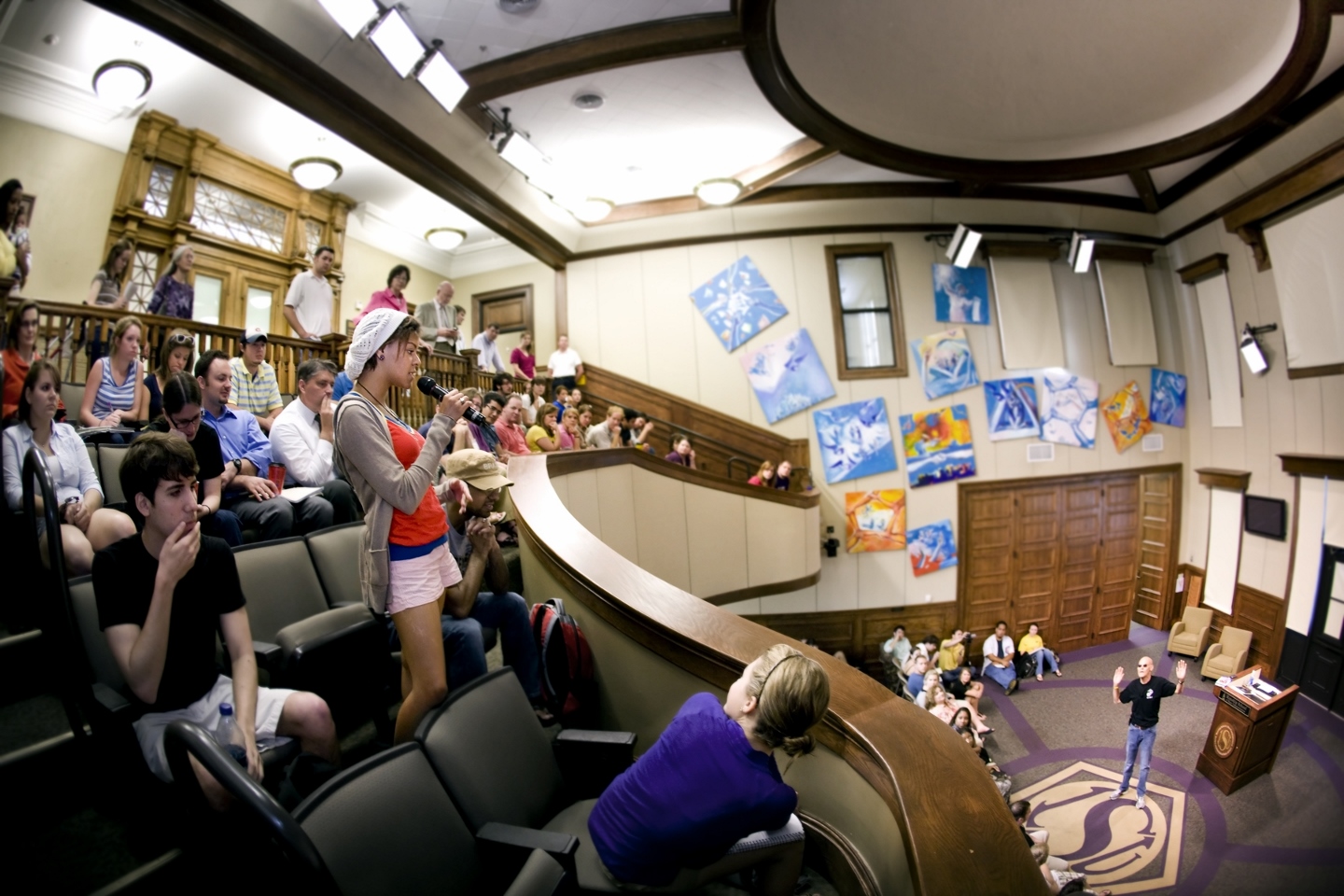 Image of students clapping in the upper section of the Holliday Forum