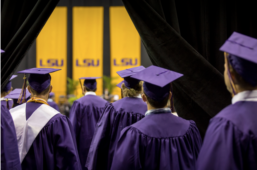 students in graduation cap and gowns